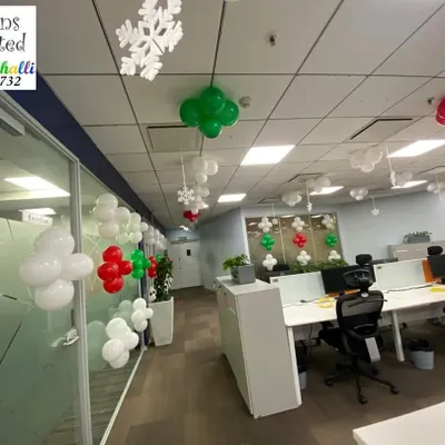 Getting this office in the festive spirit with Christmas themed balloon decorations and snowflake cutouts hanging from the ceiling.
