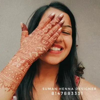 My profession is spreading happiness, one henna design at a time. Seeing my clients smile like this is the best reward for my art.