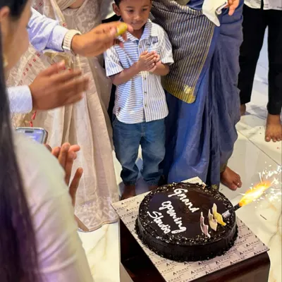 Celebrating the grand opening with a special cake and the bright spark of a new venture. It was a beautiful moment shared with family and friends who supported this dream.