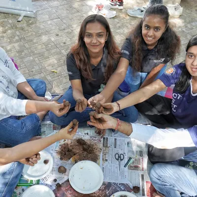 A group of students and faculty from Ramaiah University join hands to create over 100 seed balls. This hands-on activity is a wonderful way to engage in environmental stewardship and team collaboration.