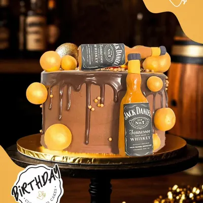 Cheers to a bold celebration with this Jack Daniel's themed cake. It features edible whiskey bottle replicas and a rich chocolate truffle base, making it a perfect surprise for a milestone birthday.