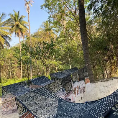 Freshly printed fabrics drying in our garden. The rich indigo and earthy tones are all achieved using natural dyes, a process that is gentle on the planet and beautiful on the cloth.
