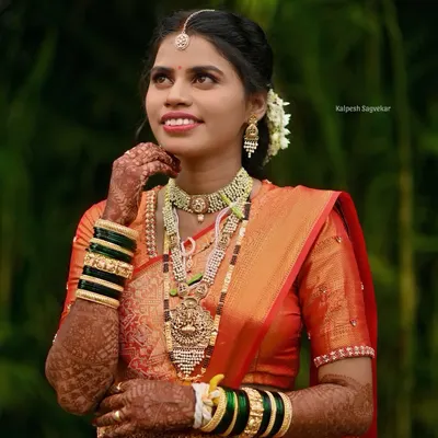 A picture perfect Maharashtrian bride. I draped her rich orange silk saree to highlight its intricate border and ensure she looked and felt her absolute best for her wedding photography.
