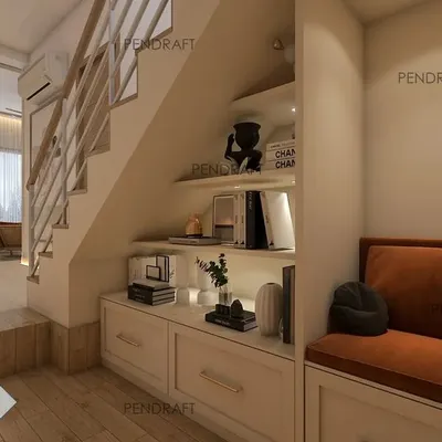 We transformed the dead space under a staircase into a cozy reading nook with a comfortable seat and built-in storage, creating a charming and highly functional feature.