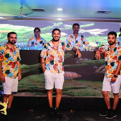 Our team, dressed in vibrant, themed attire for an underwater-themed birthday party. We always dress to match the vibe of your event, ensuring a cohesive and professional look.