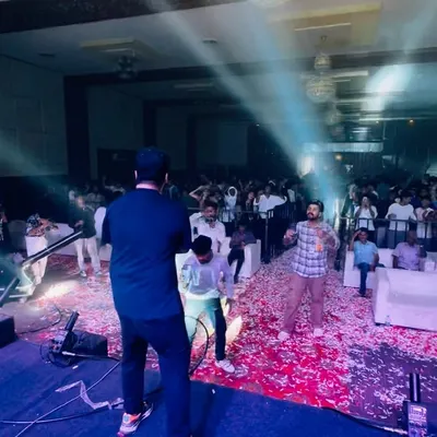 On stage at a college fest, with the confetti cannon going off. The energy from the students is absolutely electric.