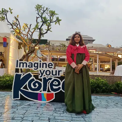 Standing proudly by the 'Imagine your Korea' sign at the Korean Street Fair. My presence at these events as a K-influencer helps drive visibility and reinforces the event's connection to the authentic Hallyu community.