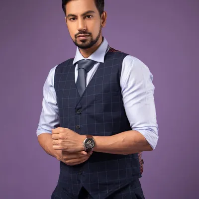A classic corporate headshot. The pose is confident and the direct eye contact is engaging. I used a simple purple background for a modern touch.