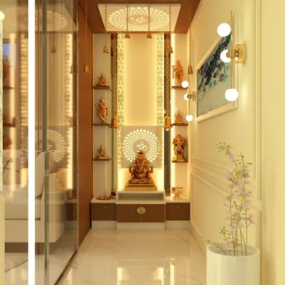 An exquisitely designed puja room that radiates serenity and devotion. The unit features intricate golden metalwork, multi-level shelves for idols, a CNC-cut 'Om' motif, and a backlit ceiling panel, creating a divine and peaceful atmosphere.