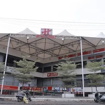 The completed 'Ayur Mall' in Amravati, a growing tier-three city. We solved the challenge of a triangular plot by creating two frontages, ensuring every shop has maximum visibility and access, which is crucial for commercial success.