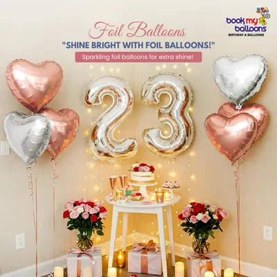 This romantic setup is perfect for a birthday or anniversary surprise. It features large foil number balloons, floating heart shaped balloons, and fairy lights to create a warm and intimate atmosphere. We can deliver and set this up anywhere in Bangalore.
