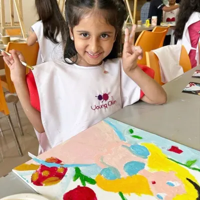 A perfect party moment! This birthday girl is all smiles during her 'Alice in Wonderland' themed art party. I customize everything, including aprons, to make the day truly special.