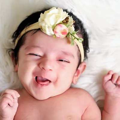 That scrunchy, gummy smile is just the best. I live for these moments of pure, unfiltered joy. Capturing a baby's personality is what makes each session unique.
