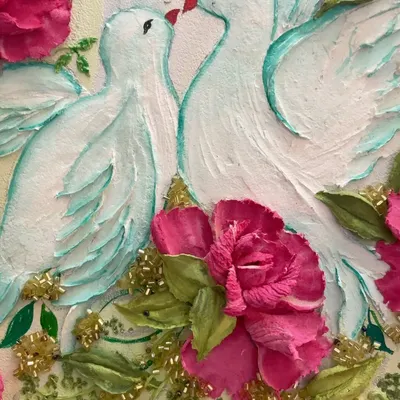 A close-up of the two sculpted white pigeons from my large circular panel. I used the palette knife to create the texture of their feathers and gave them a hint of turquoise for a magical touch.