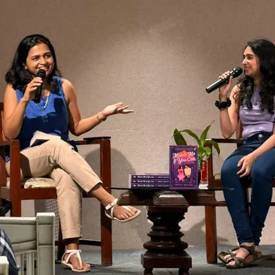 In conversation at an author event for my debut novel. I love discussing my books, the writing process, and connecting with readers in person.
