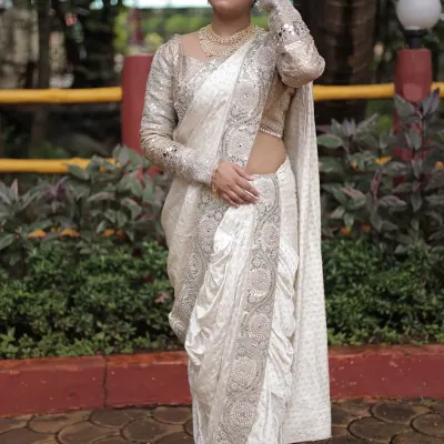 This white pre-stitched Nauvari saree with silver embroidery is the definition of grace. The full-sleeve blouse adds a modern touch to the traditional drape.