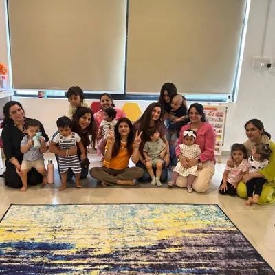 A happy group of moms and munchkins after a fantastic session together. I love creating a space where parents can connect while their little ones play and learn. This is what my community is all about.