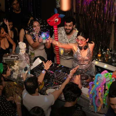 The vibes are always immaculate at Paradisco. Here I am in the middle of the crowd, sharing props and dancing with everyone. It's all about creating a fun, interactive party experience.