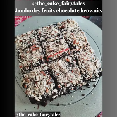 My jumbo dry fruits chocolate brownie, fresh from my kitchen. It's a rich, dense brownie topped with a thick layer of chocolate and lots of chopped nuts for a satisfying texture.