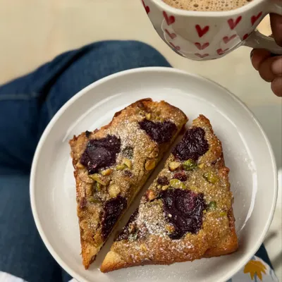 A cozy moment with late-night baking therapy: pistachio bostock with nerale (jamun) jam and a warm drink.