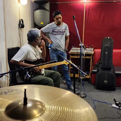 A candid shot from a jam session. This is where the magic happens, figuring out parts and just connecting through the music.