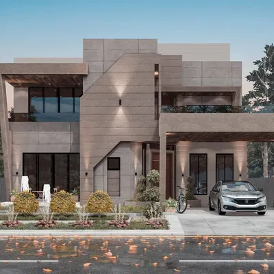 A daytime view of our modern concrete villa project, highlighting the clean lines and interplay of solid and void. The design emphasizes natural light and provides a clear view of the thoughtful landscaping integrated into the property's exterior.