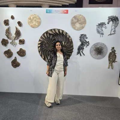 Standing with my work at the art show in Qatar. The collection on display includes my signature sculptural pieces like the large nautilus, horses, and textured floral forms.