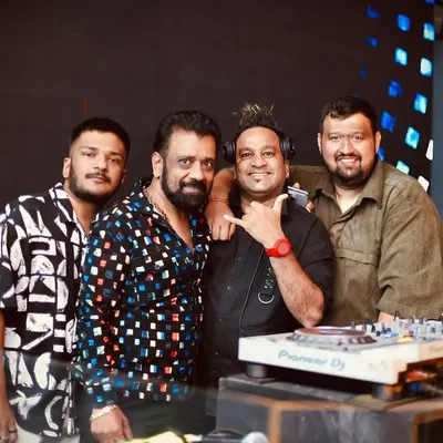 Standing with my team and fellow artists at the awards ceremony. Success is a team effort, and I'm grateful for the people who support me behind the scenes.