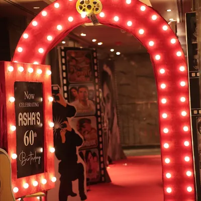 The first impression is everything. This glowing archway, designed for a retro-themed 60th birthday, set the stage for a glamorous night. I design entrances that build excitement from the very first step.