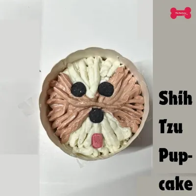 A close-up of one of my most popular items, the Shih Tzu face pupcake. I use pet-safe frosting to create a treat that is as cute as it is delicious, using only wholesome ingredients.