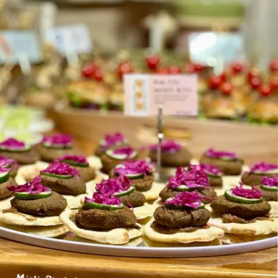 My Mini Galouti Pita Bites are a true gourmet experience. I layer a melt-in-your-mouth rajma galouti patty on a soft mini pita, then top it with tangy pickled cabbage and a punchy mint guava chutney for a burst of flavor.
