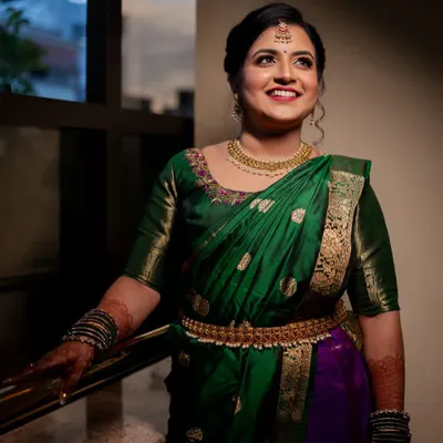 Dressed in a stunning green and purple silk saree, this client is glowing for her engagement. I enhanced her features with a warm, traditional makeup look, focusing on beautifully defined eyes and a radiant smile.