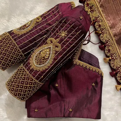 Sparkle brighter than ever. This bridal blouse features heavy zardosi and beadwork on the sleeves for a truly regal look.