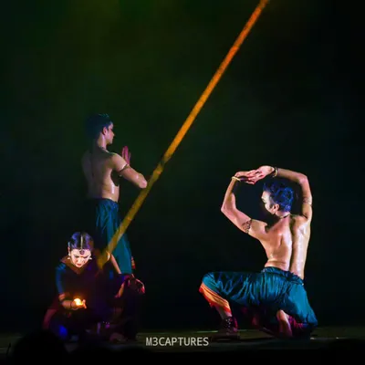 A dramatic moment from 'Nagamandala', a production by Punyah Dance Company. The lighting here, a single beam, creates a powerful focal point in the story.