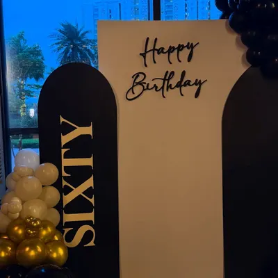 For a grand 60th birthday at Whiskey Samba in Gurgaon, we designed this sleek and modern backdrop. The black and gold color scheme with bold "SIXTY" lettering creates a timeless and celebratory photo opportunity.