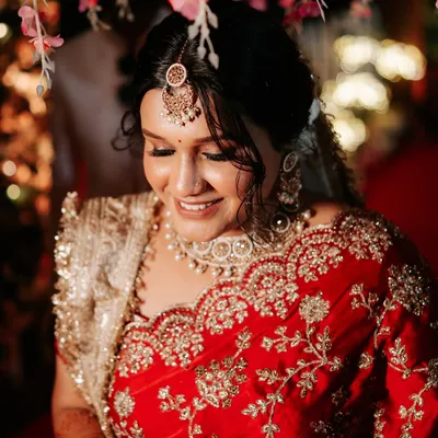A modern bride with a traditional touch. This photo captures a candid moment of the bride enjoying a coffee break during her getting-ready session.