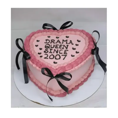 For the "Drama Queen Since 2007"! This vintage-style heart-shaped cake is a choco-blueberry flavor, decorated with pink and black piping and ribbons.