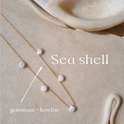My beach shell collection, featuring this Howlite choker. The small, carved shells are spaced along a delicate chain, bringing the calming energy of the ocean with you.