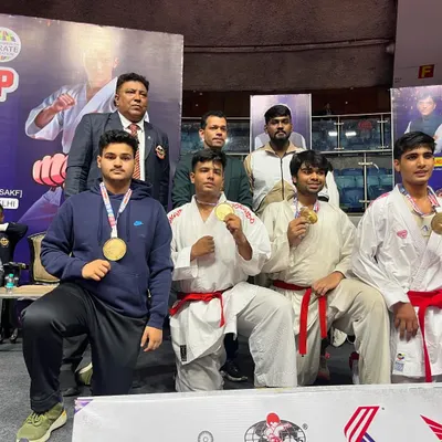 A proud moment with my students, showcasing their gold medals at the Federation Cup. Seeing their dedication rewarded is the greatest satisfaction for a coach.