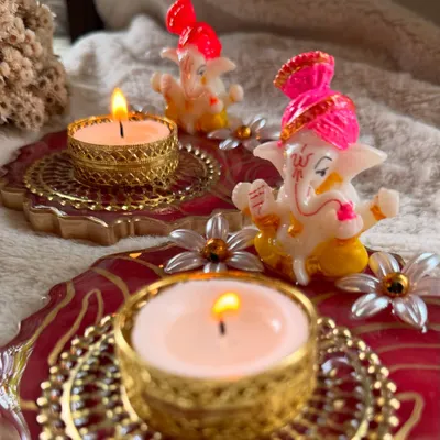 A close-up of my handcrafted resin diya with a Ganesha idol, perfect for adding a divine charm to your festive decor.