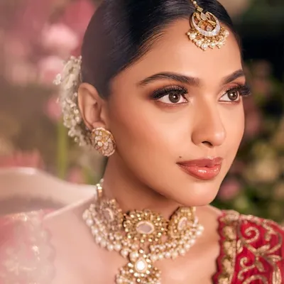 A stunningly detailed close-up from a styled shoot. This image showcases our ability to create flawless, camera-ready skin, perfectly defined eyes, and an overall look of high-fashion elegance.