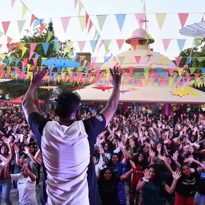 Our trainer leading a massive crowd in a dance fitness session at a Wonderla event. We love bringing the energy and joy of movement to large audiences.