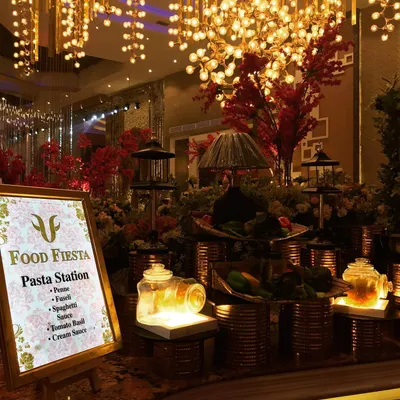 My live pasta station is a journey to Italy. Guests can choose their favorite pasta, from penne to fusilli, and watch as my chefs toss it in a sauce of their choice, be it a classic tomato basil or a rich cream sauce.