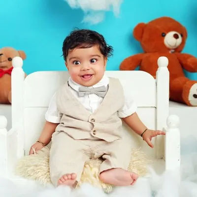 This little gentleman is sitting up like a pro. Milestone sessions are perfect for capturing these big achievements, and this "teddy bear picnic" theme adds a touch of whimsy.