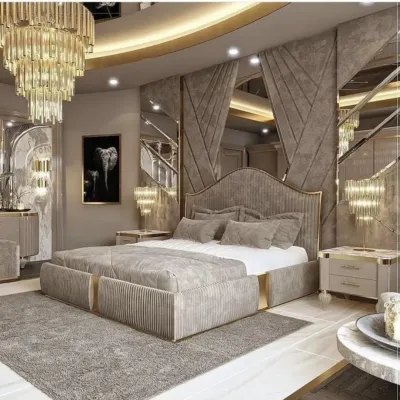 A truly grand bedroom design featuring a custom bed with a channeled headboard, gold accents, and extensive mirror work to create a sense of opulence and space.