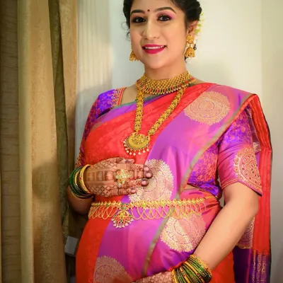 Another gorgeous mom-to-be. For her baby shower, I used bright and happy colors, with a pop of pink on the lips and shimmery eyeshadow to match her vibrant saree.