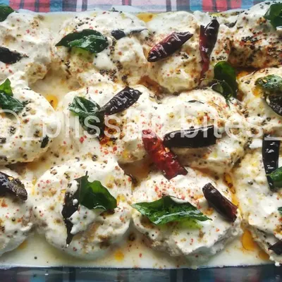 My homemade Dahi Vada, where soft vadas are drenched in thick, seasoned yogurt and garnished with spices and herbs.