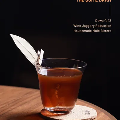 From our Dewar's 12 menu, The Quite Dram. A smoky, warm pour featuring wine jaggery reduction and our house-made mole bitters for a complex finish.