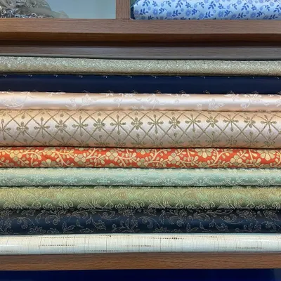 Your custom outfit starts here, with the fabric. This is a glimpse of my collection of rolled brocade and silk-blend textiles, featuring a variety of colors and woven patterns perfect for creating unique sherwanis and Jodhpuri suits.
