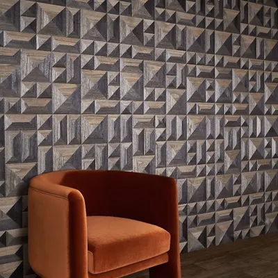 This 3D geometric wallcovering from Phillip Jeffries brings luxury and texture to the walls of this room. The interplay of light and shadow on the pyramidal shapes creates a simple yet chic space with dynamic visual interest.